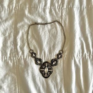 chunky gold necklace with black and white beading